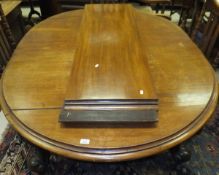 An Edwardian mahogany oval extending dining table,