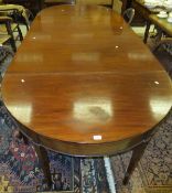 A circa 1900 mahogany D end dining table with central drop-leaf section,