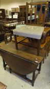 An oak drop leaf dining table, a single oak framed side chair with needlework pattern to seat,