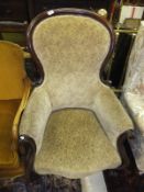 A Victorian mahogany framed spoon back armchair,