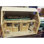 A pine doll's house style model stable, and a horse transit lorry toy inscribed "Julip Event Team",