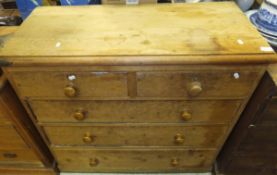 A pine chest of two short and three long drawers on a plinth base