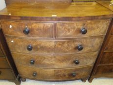 An early Victorian mahogany bow fronted chest of two short and three long graduated drawers on