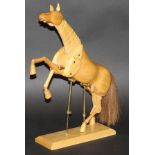 A modern artist's wooden anatomical model of a horse