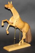 A modern artist's wooden anatomical model of a horse