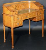 A modern satinwood and inlaid Sheraton revival style Carlton House desk of small proportions