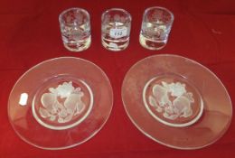 A collection of five Lalique style frosted glass fruit decorated plates and three etched glass