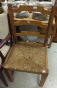 A set of six modern pine bar back kitchen chairs with rush seats