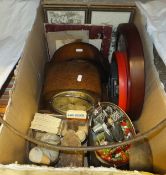 A box containing an early 20th Century iron hoola hoop, two mantel clocks, two shoe lasts,