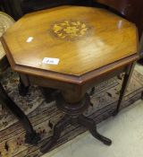 A Victorian walnut trumpet shaped work table with fitted interior on a hipped tripod base