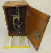 A 19th Century brass monocular microscope by Baker of 244 High Holborn Street, London,