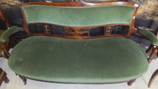 A late Victorian walnut framed salon settee,