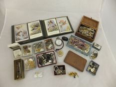 A box of assorted costume jewellery to include silver and other brooches, various earrings,