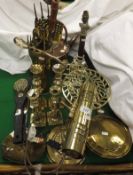 A copper and brass range kettle, two pairs of brass candlesticks,