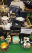 A box containing a large collection of decorative ceramics,