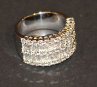 An 18 carat white gold and multiple round and baguette cut diamond ring, approx 2.