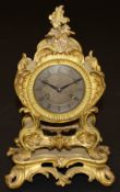 A 19th Century gilt brass cased mantel clock in the Rococo style of Louis XV, the eight day movement