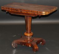 An early Victorian rosewood card table, the rectangular foldover top opening to reveal a circular