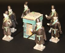 A Ming Dynasty glazed pottery sedan chair group, polychrome decorated in dark ochre and turquoise,