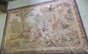 An Aubusson tapestry carpet / wall hanging depicting a pastoral scene with figures in 18th Century