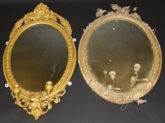 A circa 1900 giltwood and gesso framed girandole mirror in the Louis XVI taste with two sconces,
