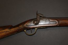 A 19th Century Brown Bess rifle, hammer action, the side plate stamped "1815",