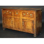 A George III oak enclosed dresser,