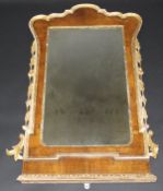 A 19th Century walnut and carved giltwood framed wall mirror in the early 18th Century manner,