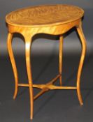A 19th Century satinwood and mahogany cross-banded oval topped occasional table,