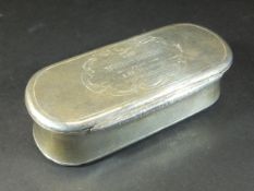 A Victorian silver hinged lidded box of elongated oval form with waisted sides and engine turned