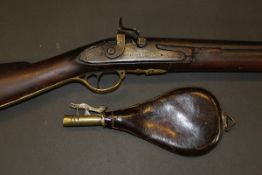 A 19th Century muzzle loading rifle, hammer action, the steel side plate inscribed "E Weston",