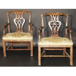 A pair of George II Irish walnut framed carver dining chairs in the Chippendale taste, the carved