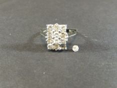 An 18 carat white gold ring set with twelve diamonds, approx 0.