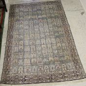 A Persian silk carpet,