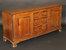 An 18th Century North Country oak enclosed dresser,