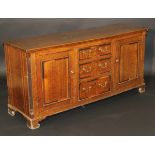 An 18th Century North Country oak enclosed dresser,
