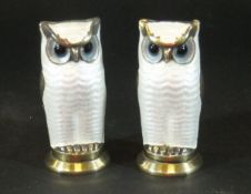 A pair of David Andersen novelty peppers in the form of owls with white and black enamelled