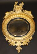 A 19th Century carved giltwood and gesso framed wall mirror in the George III taste,