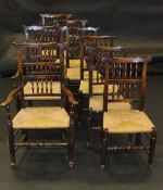 A composite set of eight North Country elm and oak spindle back rush seat dining chairs in the 17th