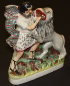 A 19th Century Staffordshire pottery flat back figure group depicting Sampson and the lion,