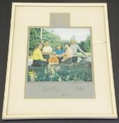 A framed and glazed colour image of the Royal Family at Balmoral in kilts (except Prince Philip)