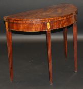 A late George III mahogany demi-lune table with ebony and boxwood stringing,