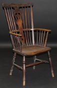 A mid 19th Century beech, elm and ash Windsor style armchair with shield shaped carved back splat,