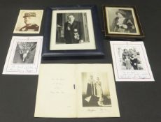 A framed and glazed black and white photograph of Queen Elizabeth (later the Queen Mother) signed "