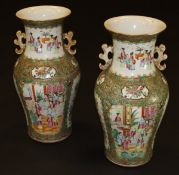 A pair of large 19th Century Chinese porcelain baluster shaped vases decorated in the famille-rose