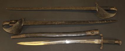 An 1856 pattern sword bayonet in steel mounted leather scabbard,