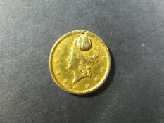 A 1850 US gold dollar coin
