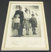 A framed and glazed image of Her Majesty The Queen and Prince Philip with Prince Charles and