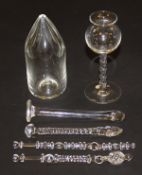 An early 19th Century glass Bitters dispenser of cylindrical form with pointed top cut with flutes,