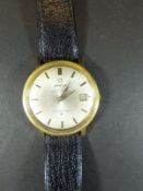 A gentleman's gold cased Omega Constellation wristwatch, the satin dial with date aperture and